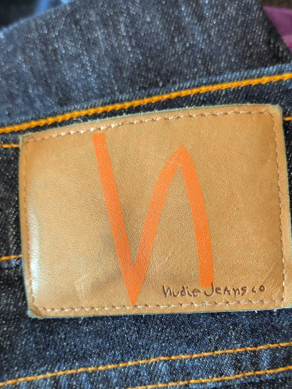 Nudie Jeans Dark Blue Denim with Orange Stitching and Leather Patch